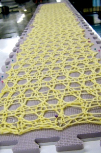 Elise's lace confection of a scarf being blocked 